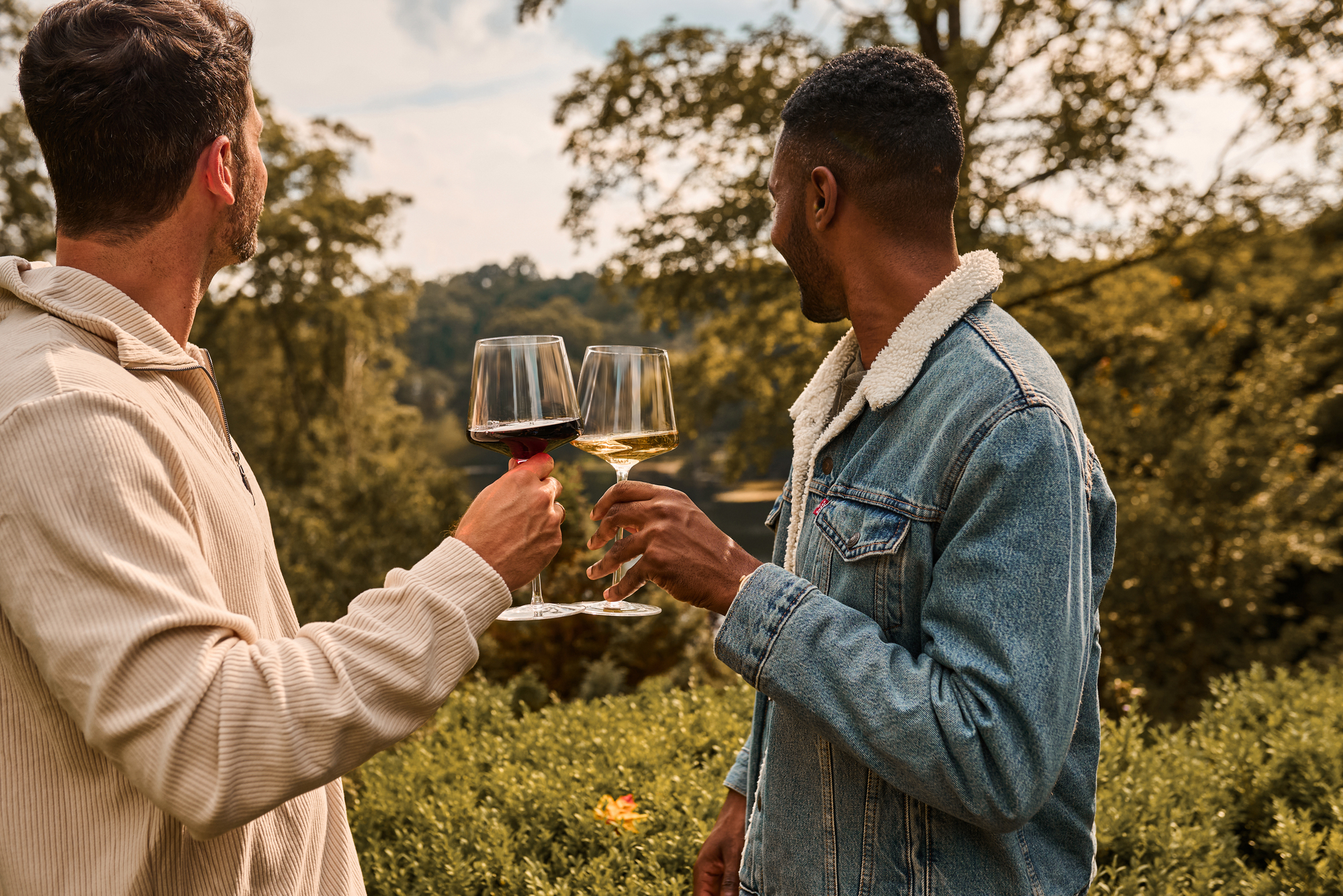 Two friends enjoying a glass of wine outdoors